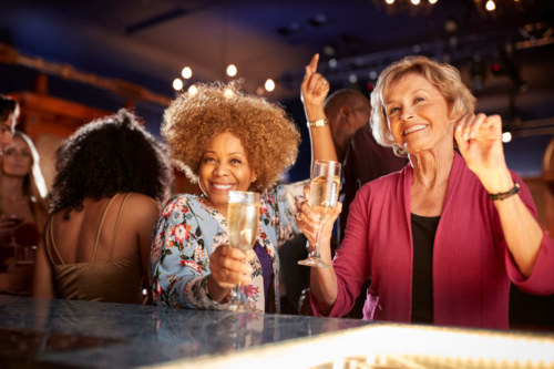 Retired women celebrate at a crowded party
