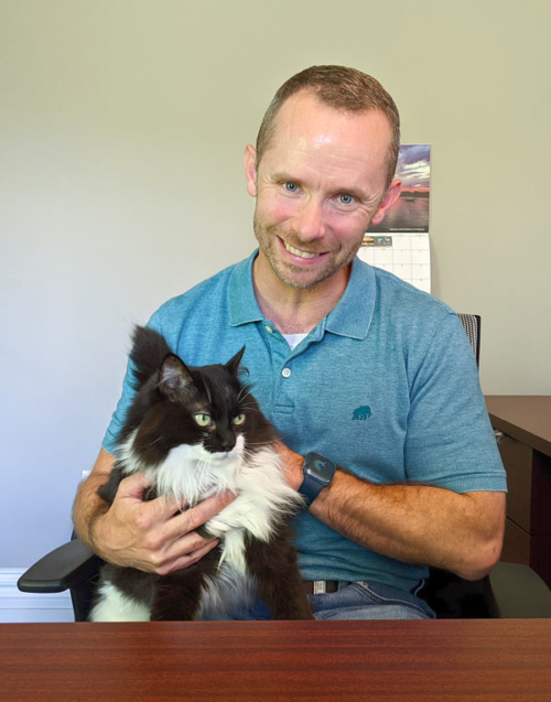 Johnny Bielski with Belle, Berkshire Money Management's office cat