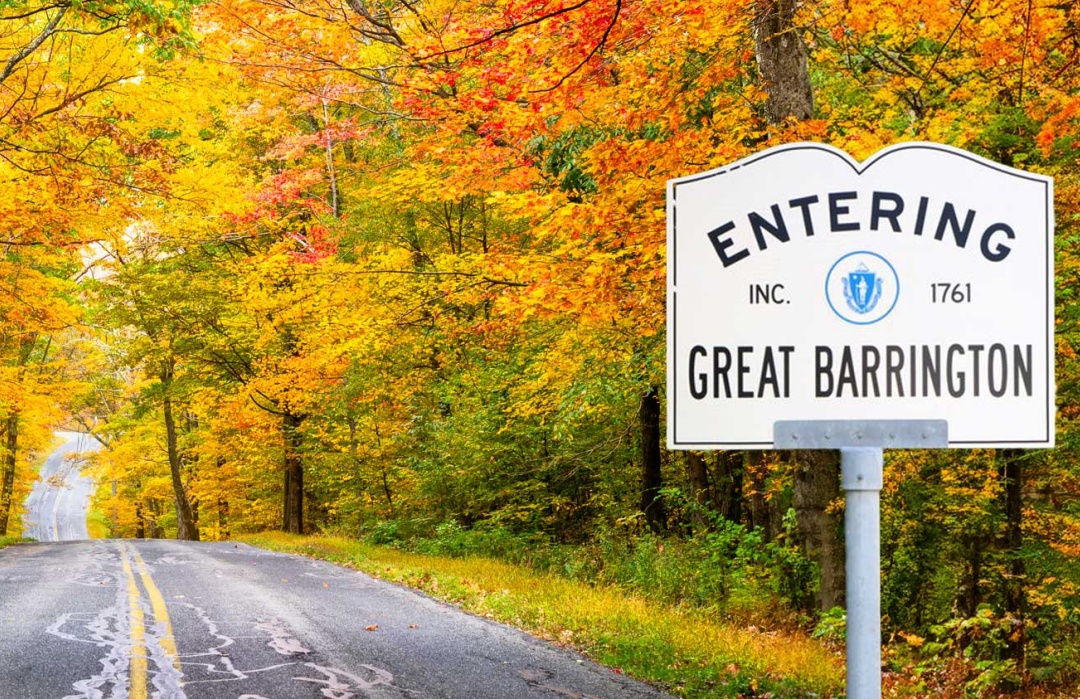 Moving to The Berkshires represented by picture of Great Barrington road sign