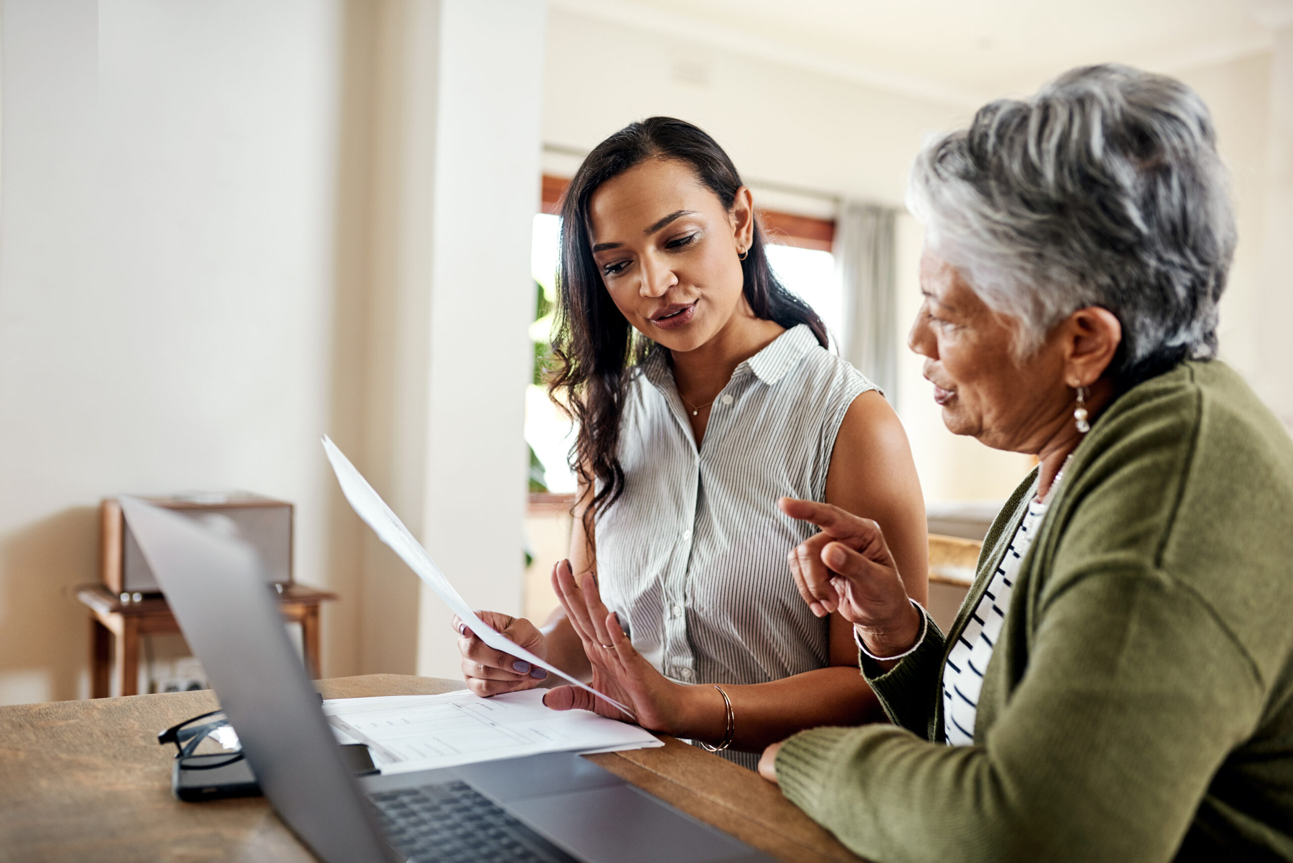 Image of two people talking about finances